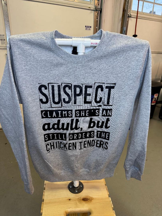 SUSPECT CLAIMS SHE'S ADULT BUT STILL ORDERS THE CHICKEN FINGERS CREWNECK